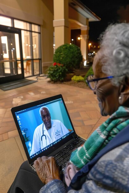 A doctor in Venezuela using telemedicine to consult with a patient in a remote area of the country. The setting should look modern and connected.
