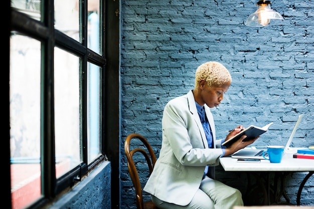A Venezuelan lawyer reviewing legal documents related to healthcare investments. The scene should convey professionalism and attention to detail.