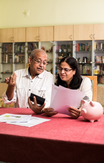 A diverse group of people attending a financial literacy workshop in Venezuela. The room is brightly lit, and the participants are engaged in the presentation, taking notes and asking questions. The scene reflects a community seeking knowledge and support for financial stability.