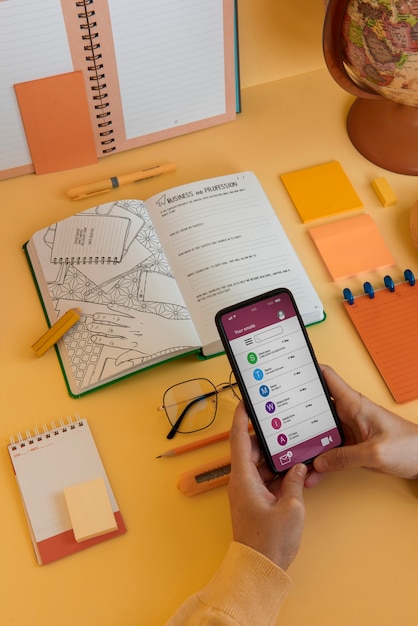 A person using a mobile app on their smartphone to track their expenses and manage their budget. The app interface is clean and user-friendly, displaying colorful charts and graphs.