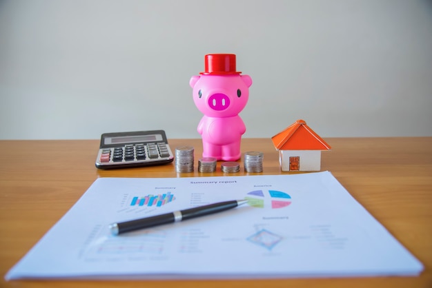 A visual representation of a saving plan, showing money being deposited into a piggy bank or a savings account, with charts indicating progress towards a financial goal.